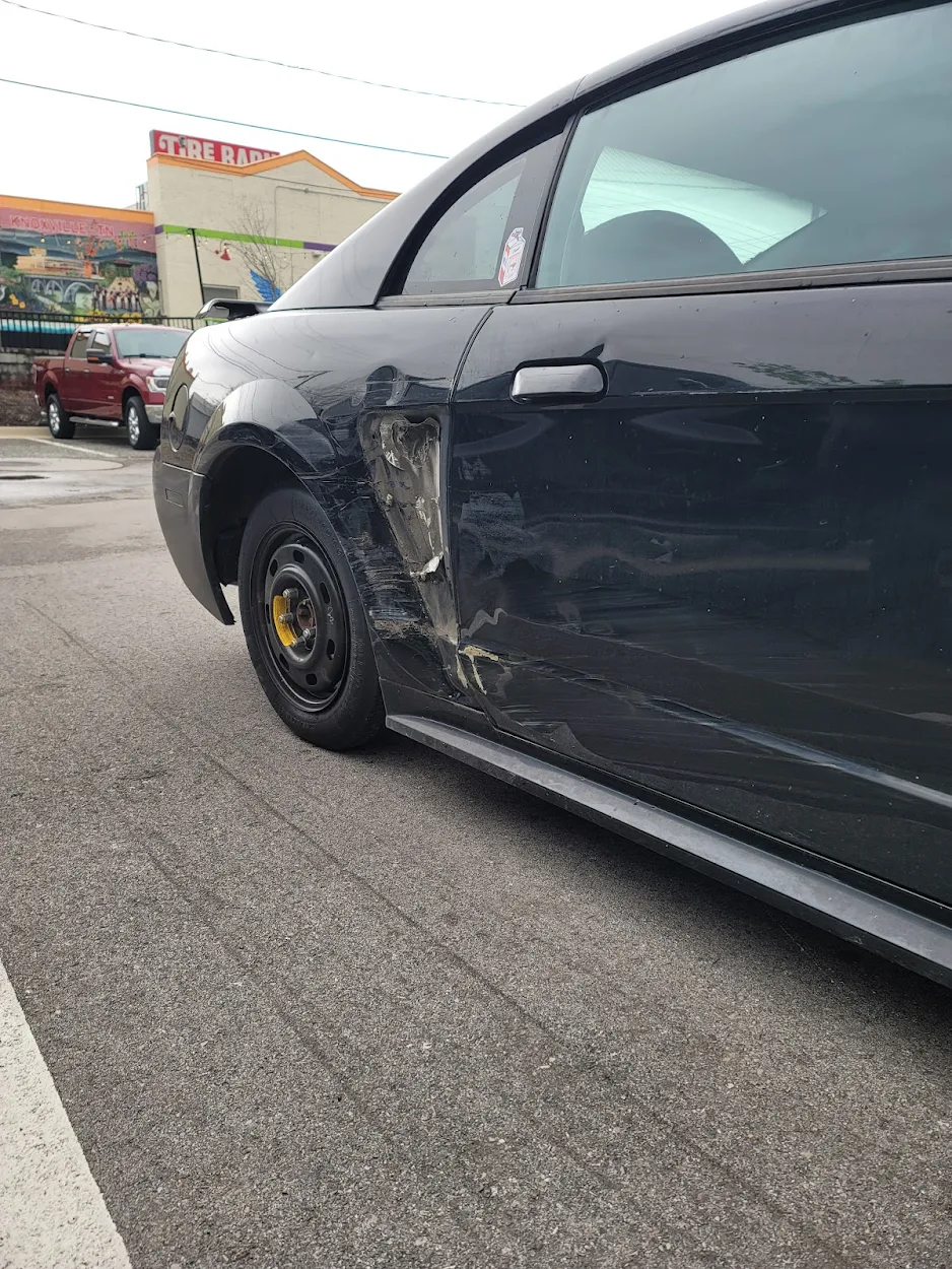 Before: Panel repair and color-matched paint work by All Colors Body Shop